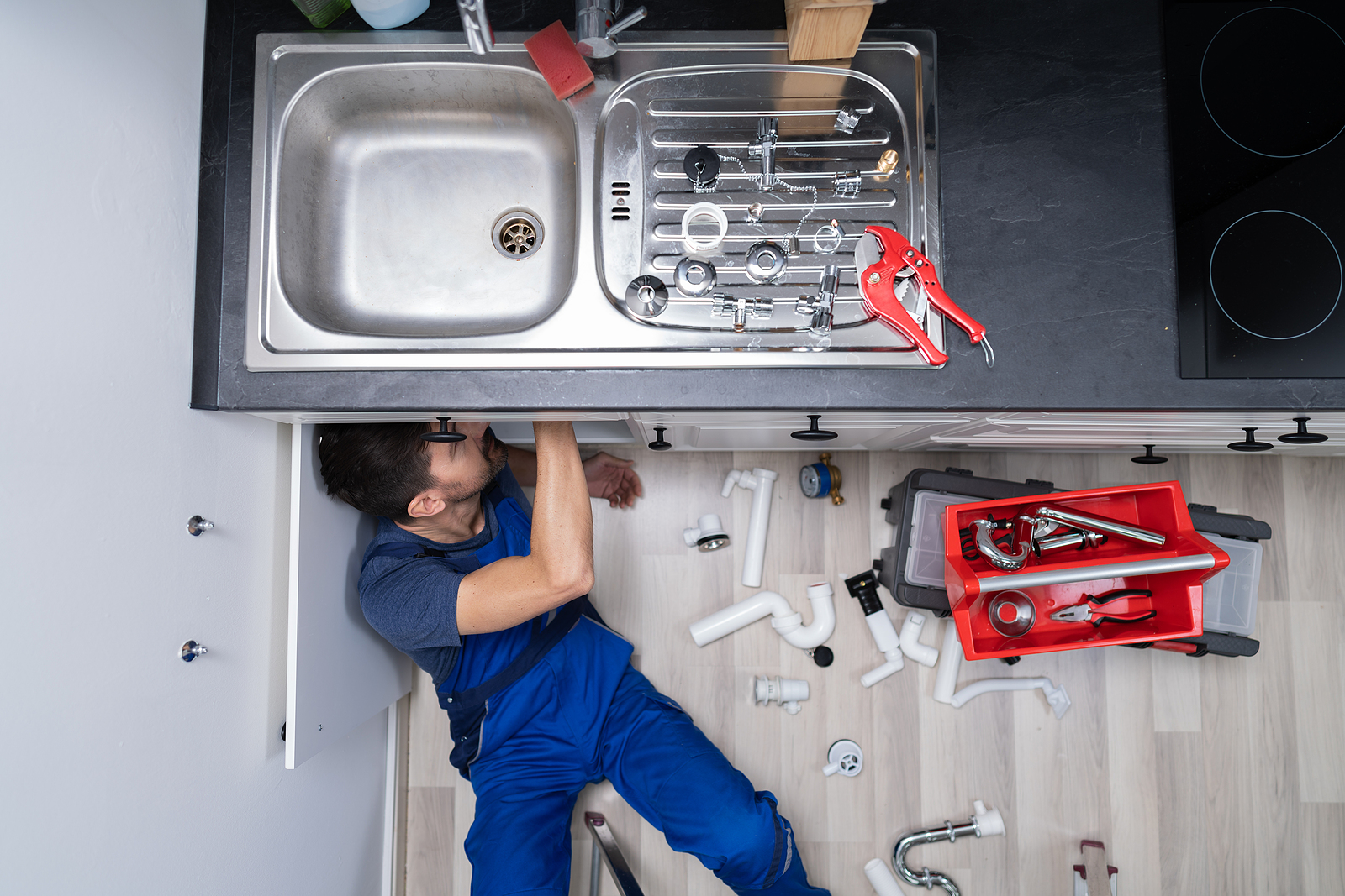 Plumber fixing a pipe